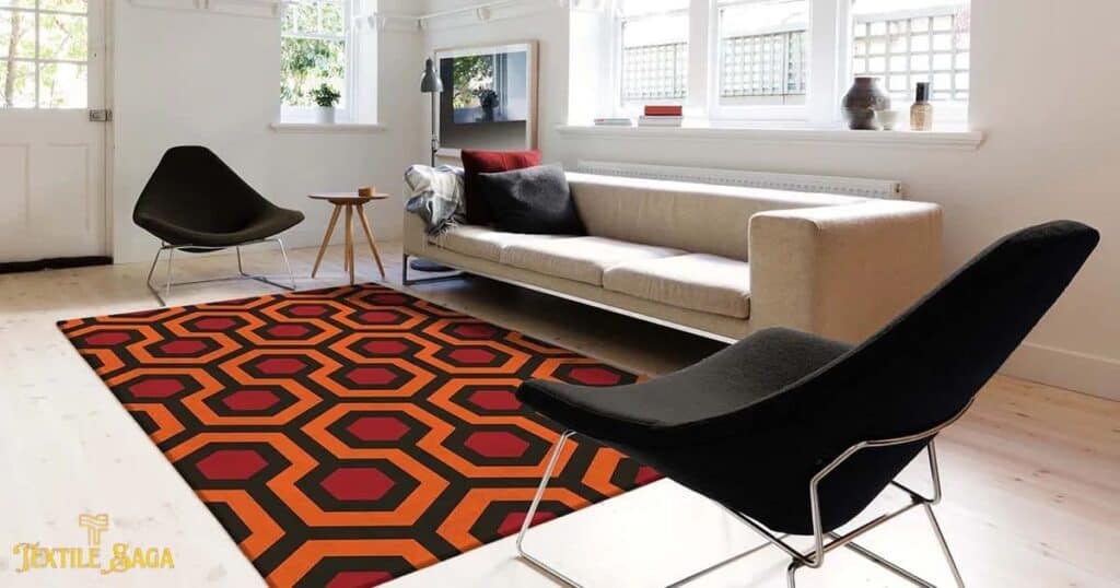 a beautiful solid and bold pattern rug is placed under a sofa.
